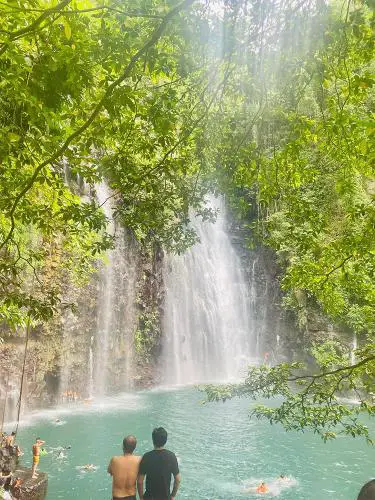 People enjoying the waterfall.
